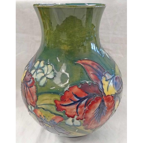 3043 - MOORCROFT GREEN GROUND VASE WITH ORCHID PATTERN, IMPRESSED AND SIGNED WITH PAPER LABEL TO BASE, 24CM... 