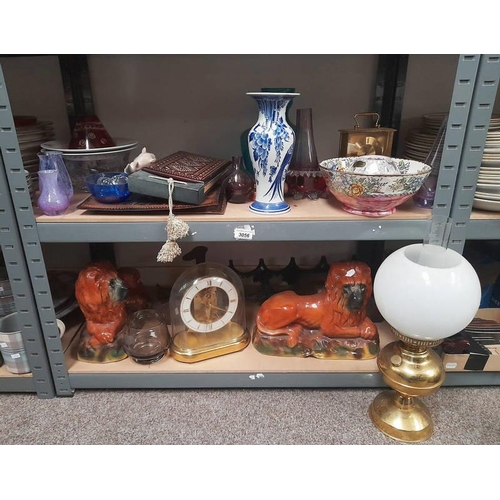 3056 - 2  19TH CENTURY PORCELAIN LIONS BRASS PARAFFIN LAMP, DOMED CLOCK, COLOURED ART GLASS VASES ETC ON 2 ... 