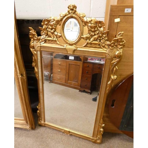 31 - DECORATIVE CARVED GILT FRAME MIRROR WITH BEVELLED EDGE, INNER DIMENSIONS: 82CM TALL X 56CM WIDE