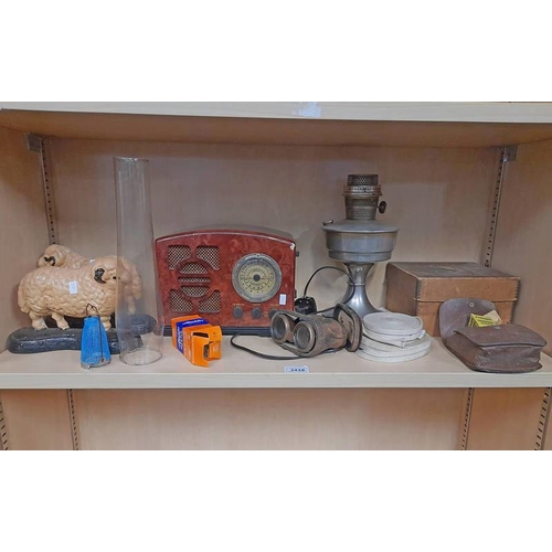 3418 - PAIR CAST IRON SHEEP DOOR STOPS, RADIO, PARAFFIN LAMP ETC ON ONE SHELF