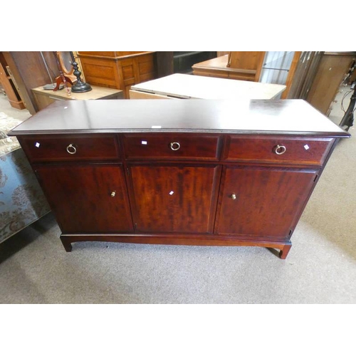 506 - STAG MAHOGANY SIDEBOARD WITH 3 DRAWERS OVER 3 PANEL DOORS.  141 CM LONG