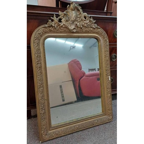 142 - 19TH CENTURY MIRROR WITH DECORATIVE CARVED GILT FRAME INNER DIMENSIONS.  58 CM TALL X 40 CM WIDE