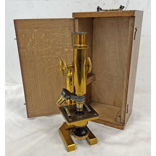 1039 - BRASS MICROSCOPE BY R & J BECK, LONDON, GILT BRASS BODY WITH 2 LENSES & WOOD CASE