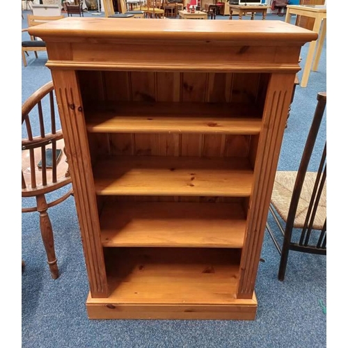 5006 - PINE OPEN BOOKCASE ON PLINTH BASE.  107 CM TALL X 66 CM WIDE