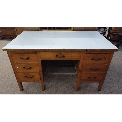 5021 - OAK DESK WITH FORMICA TOP[ & 7 DRAWERS ON SQUARE SUPPORTS.  138 CM LONG X 79 CM DEEP