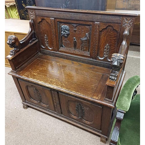 5023 - 19TH CENTURY OAK SETTLE BENCH WITH DECORATION CARVED CLASSICAL SCENE BACK & LION MARK ARMS