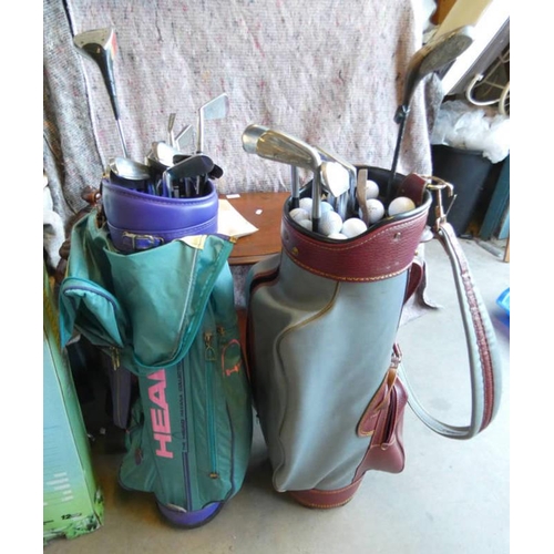 6017 - 2 GOLF BAGS WITH GOOD SELECTION OF CLUBS AND BALLS