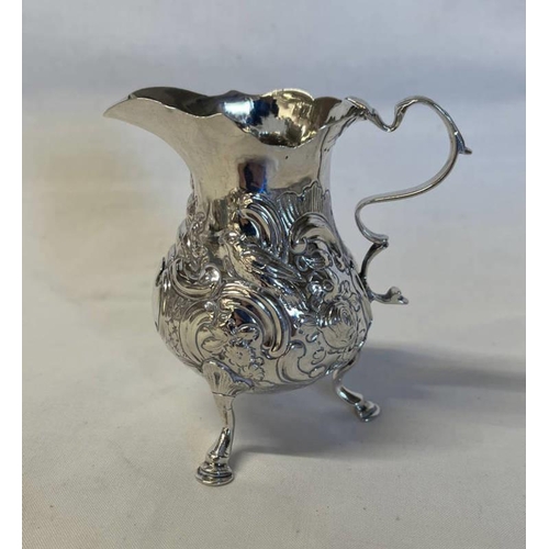 87 - GEORGE III SILVER CREAM JUG WITH EMBOSSED DECORATION, LONDON CIRCA 1771 - 70G