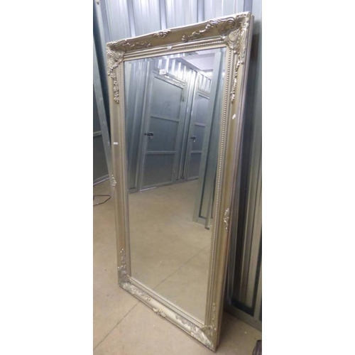 126 - RECTANGULAR MIRROR WITH DECORATIVE SILVERED FRAME .  INNER DIMENSIONS  140 CM TALL X 59 CM WIDE