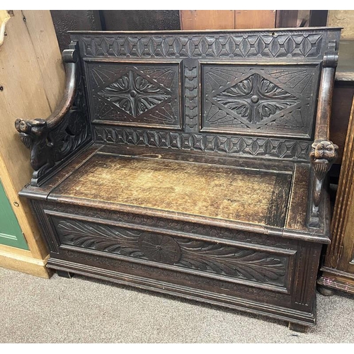 17 - LATE 19TH CENTURY CARVED OAK HALL SETTLE - 106CM WIDE