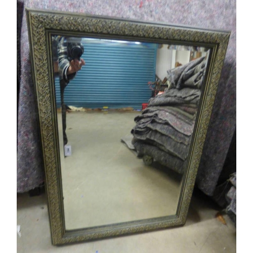 194 - BEVELLED EDGED RECTANGULAR MIRROR WITH DECORATIVE FRAME. INNER DIMENSIONS.  51 CM TALL X 75 CM WIDE