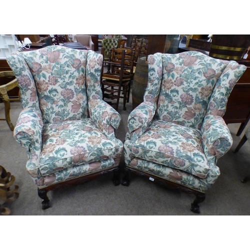 234 - PAIR OF 19TH CENTURY STYLE WINGBACK ARMCHAIRS ON CARVED MAHOGANY BASES WITH BALL & CLAW SUPPORTS.