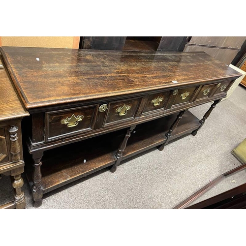 299 - 18TH/ 19TH CENTURY OAK DRESSER BASE WITH 3 DEEP DRAWERS WITH BRASS HANDLES & UNDERSHELF ON TURNED SU... 