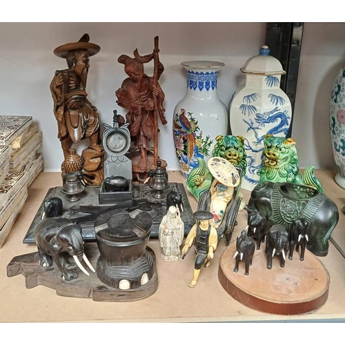 3021 - 2 EASTERN WOODEN CARVINGS, BRONZE ELEPHANT, WOOD DESK SET, VASES, ETC ON 1/2 SHELF