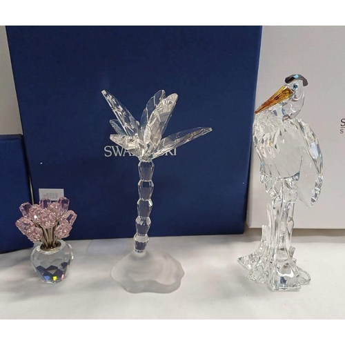 3061 - 3 BOXED SWAROVSKI CRYSTAL FIGURES; DOZEN PINK ROSES, SILVER CRYSTAL HERON & PALM TREE