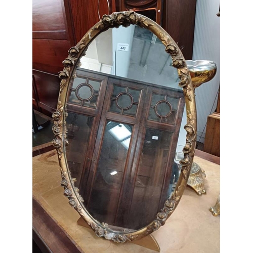 443 - OVAL GILT MIRROR WITH DECORATIVE FRAME ON STAND