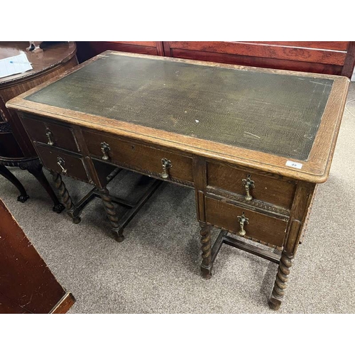 49 - EARLY 20TH CENTURY OAK KNEEHOLE DESK WITH LEATHER INSET ON BARLEY TWIST SUPPORTS - 121CM WIDE