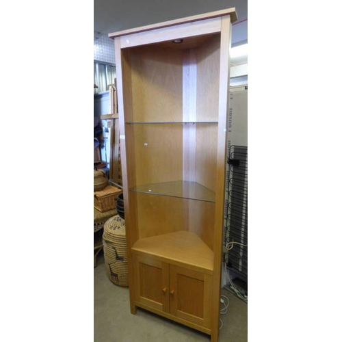 62 - OAK CORNER CABINET WITH GLASS OPEN SHELVES OVER 2 PANEL DOORS