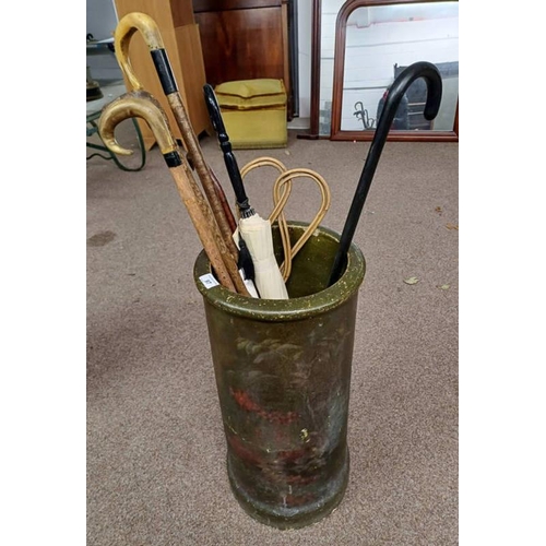 97 - RECONSTITUTED STONE STICK STAND WITH PAINTED DECORATION & CONTENTS OF WALKING STICKS, ETC