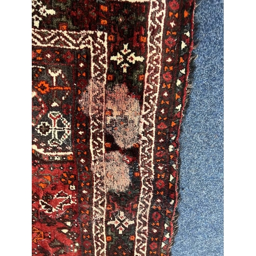 1553 - LARGE RED GROUND MIDDLE EASTERN CARPET BY THE PERSIAN RUG COMPANY, 250 X 360 CM