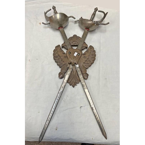 1089 - PAIR OF 20TH CENTURY CUP HILTED RAPIERS MOUNTED ON A CARVED WOODEN WALL MOUNT