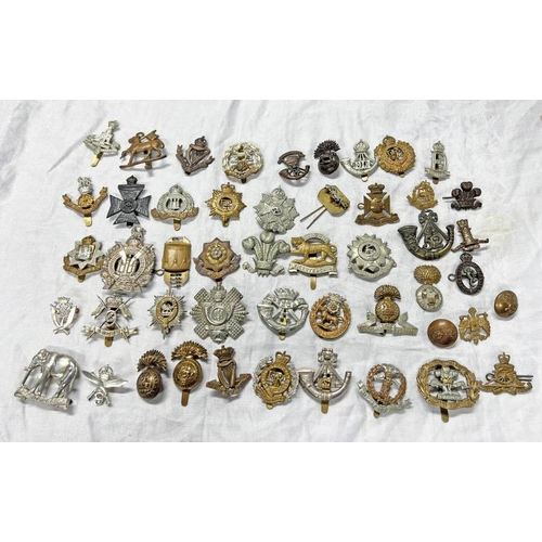 1100 - LARGE SELECTION OF MILITARY CAP BADGES INCLUDING ROYAL WEST SURREY REGIMENT, NORTHUMBERLAND FUSILIER... 