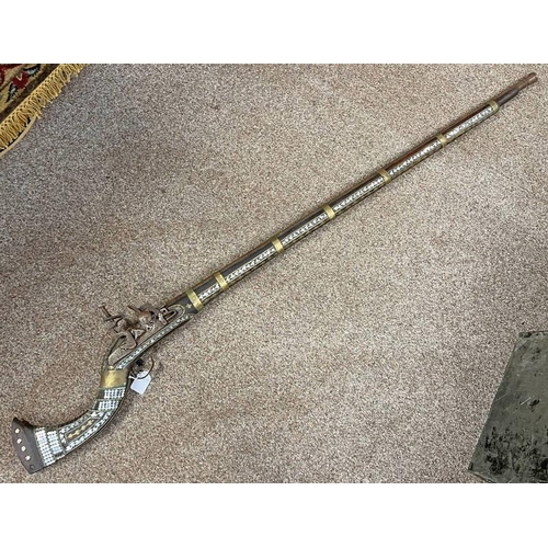 1143 - MIDDLE EASTERN FLINTLOCK JEZAIL WITH 115CM LONG STAGED BARREL, LOCK WITH MARKINGS, BRASS & MOTHER OF... 