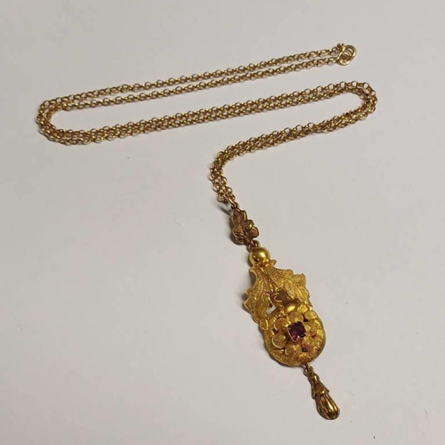 140 - 19TH CENTURY GOLD GARNET SET FOLIATE PENDANT ON A 9CT GOLD CHAIN - 6.1 G