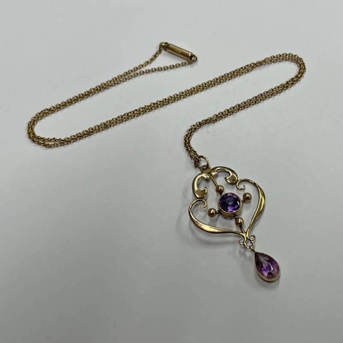 49 - ART NOUVEAU GOLD PENDANT SET WITH AMETHYSTS ON A 9CT GOLD CHAIN - 3.3G