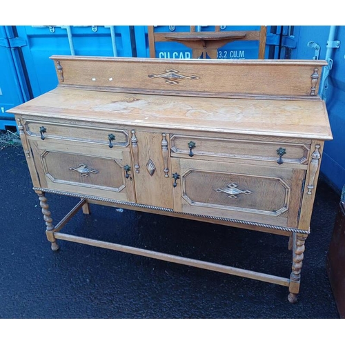 5244 - 20TH CENTURY OAK RAIL BACK SIDEBOARD WITH 2 DRAWERS OVER 2 PANEL DOORS ON BARLEY TWIST SUPPORTS.