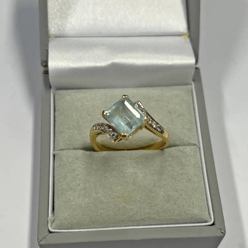 684 - 18CT GOLD DIAMOND & AQUAMARINE TWIST RING - 4.4G