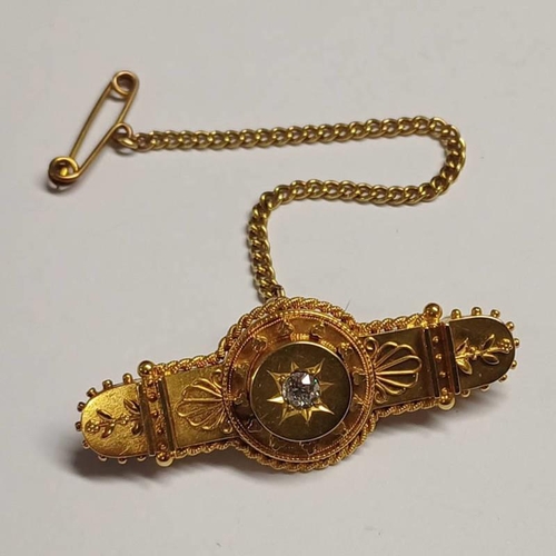 9 - LATE VICTORIAN 15CT GOLD DIAMOND SET BROOCH WITH DECORATIVE BORDER - 4.5CM LONG, 7.0G