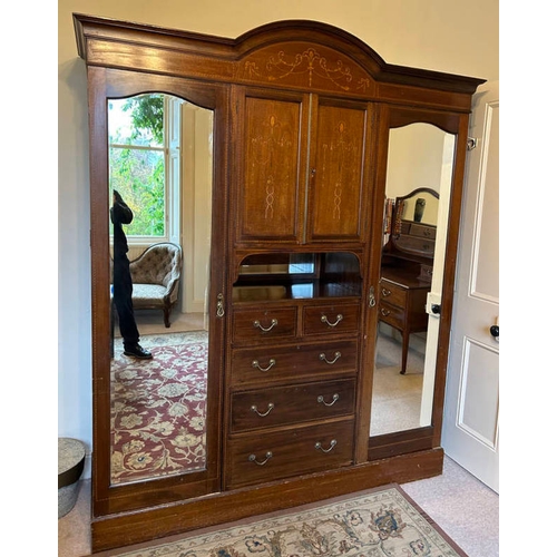 106 - EDWARDIAN INLAID MAHOGANY WARDROBE WITH PANEL DOORS OVER DRAWERS FLANKED EITHER SIDE BY MIRROR DOORS... 