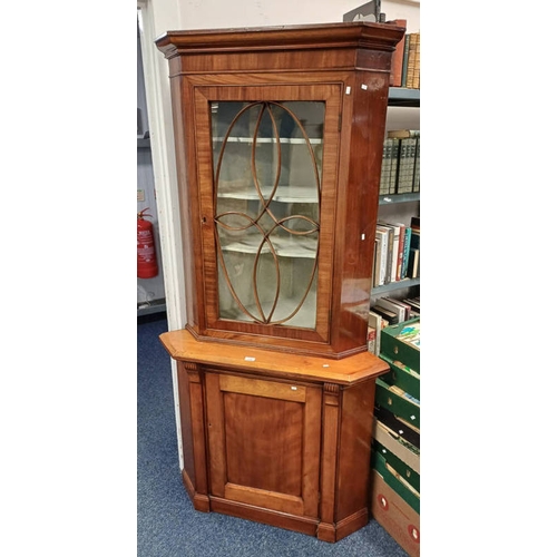 112 - MAHOGANY CORNER CABINET WITH ASTRAGAL GLASS PANEL DOOR OVER BASE WITH SINGLE PANEL DOOR. 193 CM TALL