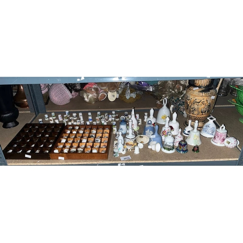 3072 - LARGE SELECTION OF THIMBLES, PORCELAIN BELLS, ETC ON 1 SHELF