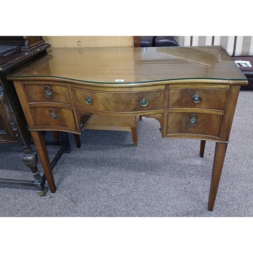 65 - LATE 19TH OR EARLY 20TH CENTURY MAHOGANY SIDE TABLE WITH SERPENTINE FRONT & CENTRALLY SET LONG DRAWE... 