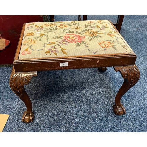 89 - MAHOGANY RECTANGULAR STOOL WITH FLORAL TAPESTRY TOP ON BALL & CLAW SUPPORTS.