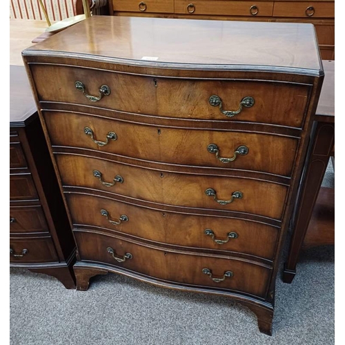 5020 - WALNUT SERPENTINE CHEST OF 5 DRAWERS ON BRACKET SUPPORTS. LENGTH 75 CMS