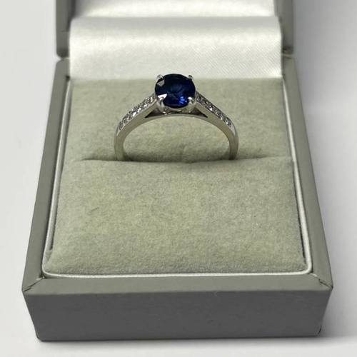 58 - PLATINUM SET SAPPHIRE SINGLE STONE RING WITH DIAMOND SET SHOULDERS, THE CIRCULAR CUT SAPPHIRE VERY A... 