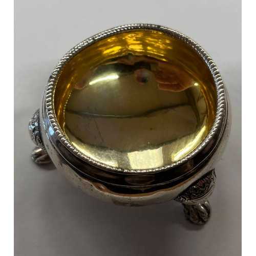 18 - GEORGE III SILVER CIRCULAR SALT WITH GILT INTERIOR & 3 BACCHUS MASK SUPPORTS BY LISTER & SONS, NEWCA... 