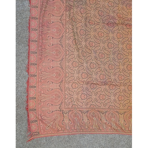 617 - RED AND GOLD PAISLEY SHAWL WITH FRINGED EDGES AND GEOMETRIC DESIGN THROUGHOUT, 188 CM X 173 CM