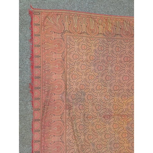 617 - RED AND GOLD PAISLEY SHAWL WITH FRINGED EDGES AND GEOMETRIC DESIGN THROUGHOUT, 188 CM X 173 CM