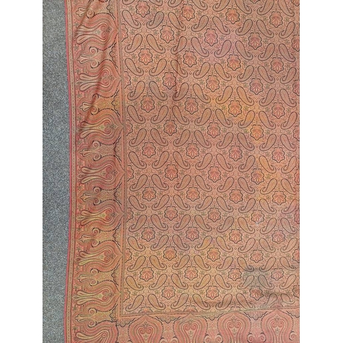 617 - RED AND GOLD PAISLEY SHAWL WITH FRINGED EDGES AND GEOMETRIC DESIGN THROUGHOUT, 188 CM X 173 CM