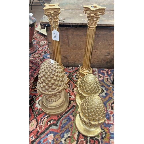 1213 - 3 GILT PINEAPPLE ORNAMENTS TOGETHER WITH A PAIR OF GILT CANDLESTICKS, 39CM TALL EACH