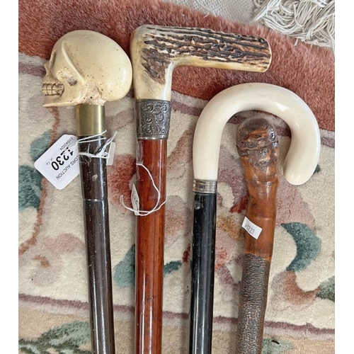 1230 - SKULL TOPPED NOVELTY WALKING CANE, HORN HANDLED SILVER BANDED WALKING CANE & 2 OTHERS