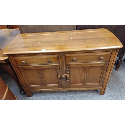 125 - ERCOL ELM SIDEBOARD WITH 2 DRAWERS OVER 2 PANEL DOORS. 85 CM TALL X 120 CM LONG