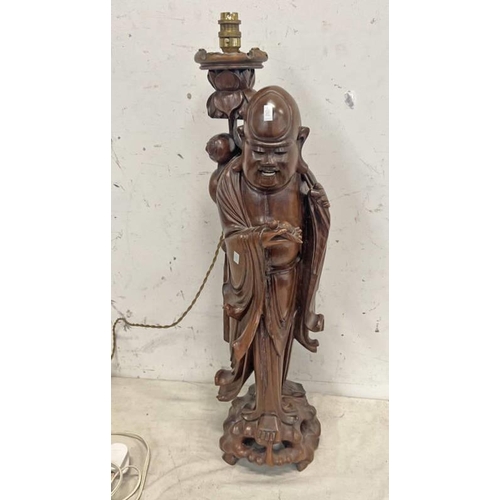 1314 - CARVED HARDWOOD ORIENTAL FIGURE TABLE LAMP, 74CM TALL