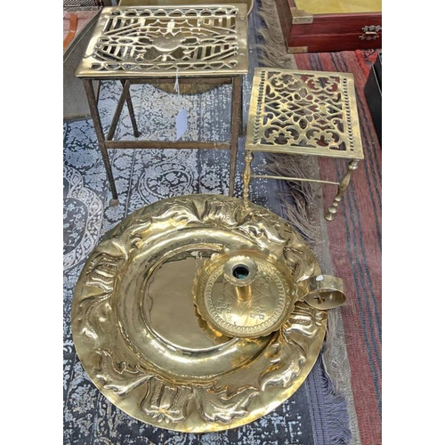 1338 - 19TH CENTURY PIERCED BRASS TRIVET, BRASS TOPPED TRIVET, ETCHED BRASS CANDLESTICK HOLDER, & A CIRCULA... 