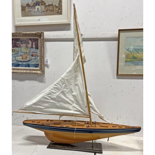 1344 - MODEL POND YACHT WITH SAIL ON STAND, 121CM LONG