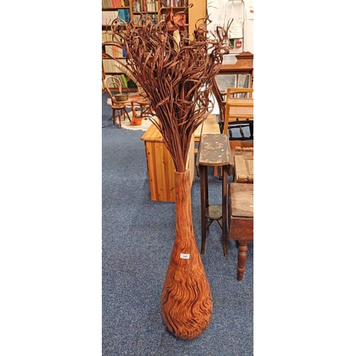 143 - EASTERN HARDWOOD VASE AND CONTENTS OF FAUX FLOWERS